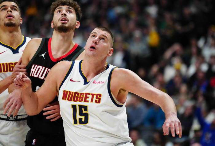Nuggets center Nikola Jokic and forward Michael Porter Jr. (1) and Houston Rockets center Alperen Sengun (28) during the first quarter at Ball Arena